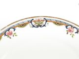 a white plate with a floral design on it