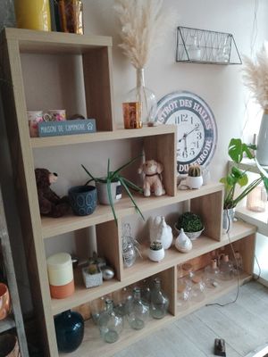 a shelf that has a clock on top of it