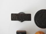 three different types of metal items on a white surface