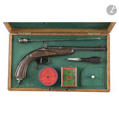 an old gun and other items in a case on a white background