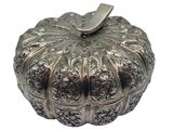 silver plated pumpkin shaped box with decorative design on top