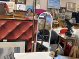 an image of a room filled with furniture and art