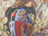 a painting of a lion holding a shield with a crown on it