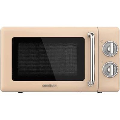 four à micro-ondes beige posé sur un plan de travail blanc, la porte ouverte