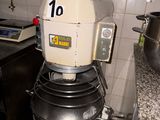 an image of a mixer in a kitchen with a lot of pots and pans