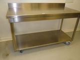 a stainless steel table with a metal shelf on it