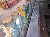 many vases and jars on the counter in the store