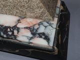 a black and white marble box sitting on a table