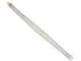 a close up of a silver bracelet on a white background