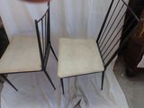 two chairs that are sitting next to each other