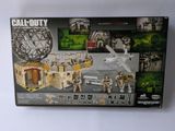 a box with a picture of a building and a toy plane