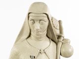 a statue of a woman holding a pot and a bottle
