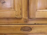 an image of a wooden cabinet with two doors and a drawer underneath it