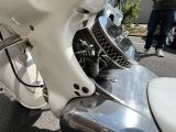 a close up of a motorcycle parked on the side of the road