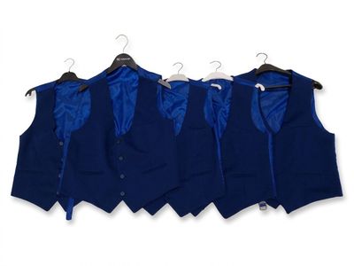 three men ' s vests hanging on a hanger on a white wall