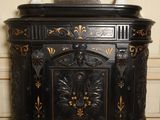 a black cabinet with a clock on top of it