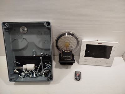 a picture of a radio and a remote control on a table