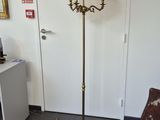 a lamp that is on a stand in a room