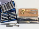 a lot of silverware in a case on a table