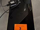 a laptop computer sitting on top of a table