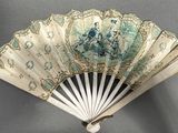 a fan that has a picture of a woman on it