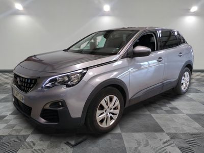a picture of a silver car parked in a garage