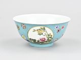 a blue bowl with a floral design on it