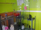 a glass display case in the corner of a room