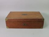 an old wooden box sitting on top of a white table