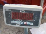 a close up of a digital scale on a construction site