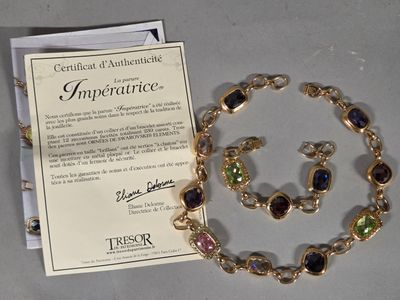 a necklace and bracelet set with a certificate on it