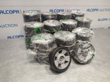 many rolls of wire wrapped around a wheel on the floor