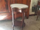 a small table with a marble top in a room