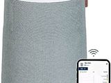 an image of a white and gray speaker with a smart phone next to it