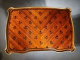 a wooden tray with a floral design on it