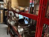 many pots and pans on the shelves in the store