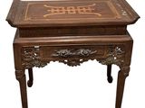 a wooden table with writing on it on it