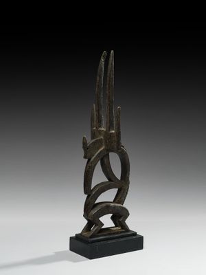 an image of a bronze sculpture of two horns on a black base