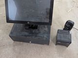 a small monitor and a camera on the ground