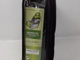 black zippered bag with a cell phone inside of it on a white surface