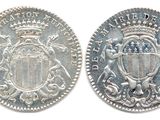 four oval metal plaques with ornate designs on them on a white background