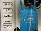 a blue air compressor sitting on a cart in a store