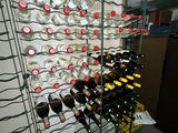 many bottles of wine in a wine rack in a room