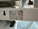 a label on the back of a washing machine