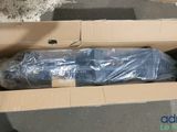 a cardboard box with a blue umbrella inside of it