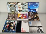 a lot of lp ' s that are on the table