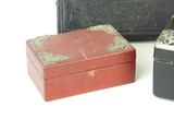 three small boxes sitting next to each other on a table