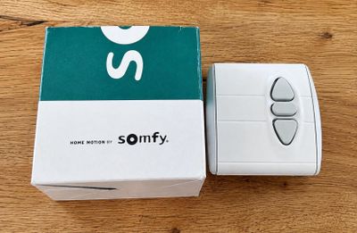 a box with a remote control sitting on a table