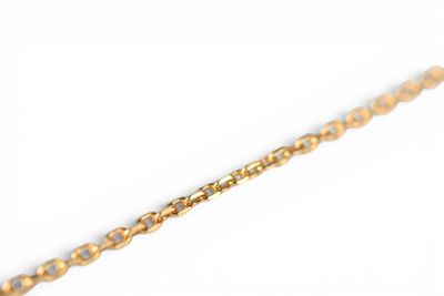 an image of a close up of a gold chain on a white background