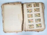 a book with stamps on it sitting on a table